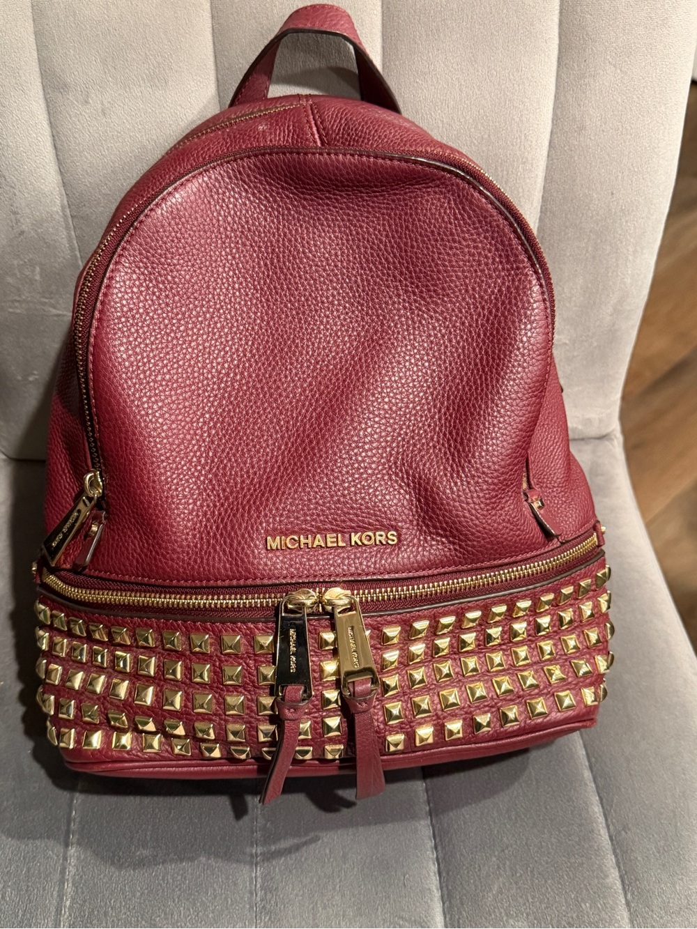 Michael Kors Burgundy Pebbled Leather Backpack with Gold Studs
